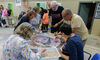 Ms de 60 usuarios de centros de mayores de Mrida replican el mosaico de la Medusa